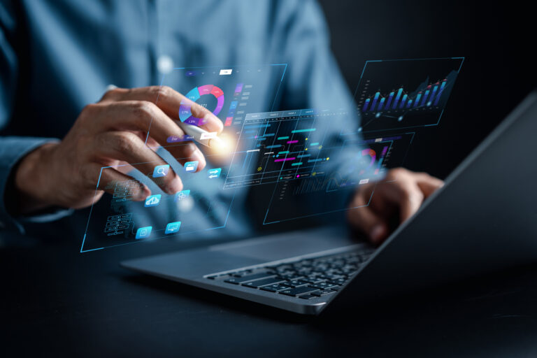 Analyst working with computer in Business Analytics and Data Management System to make report with KPI and metrics connected to database. Corporate strategy for finance, operations, sales, marketing.
